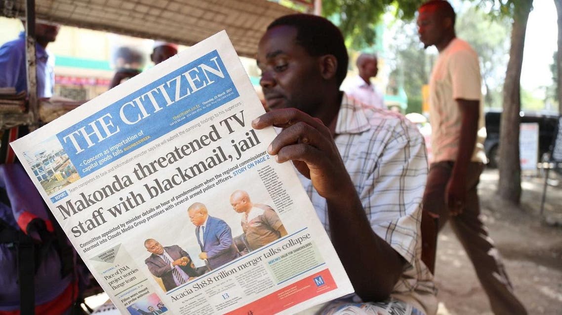 A man reads in Arusha, northern Tanzania, the local English-written daily newspaper ‘The Citizen’. (AFP)
