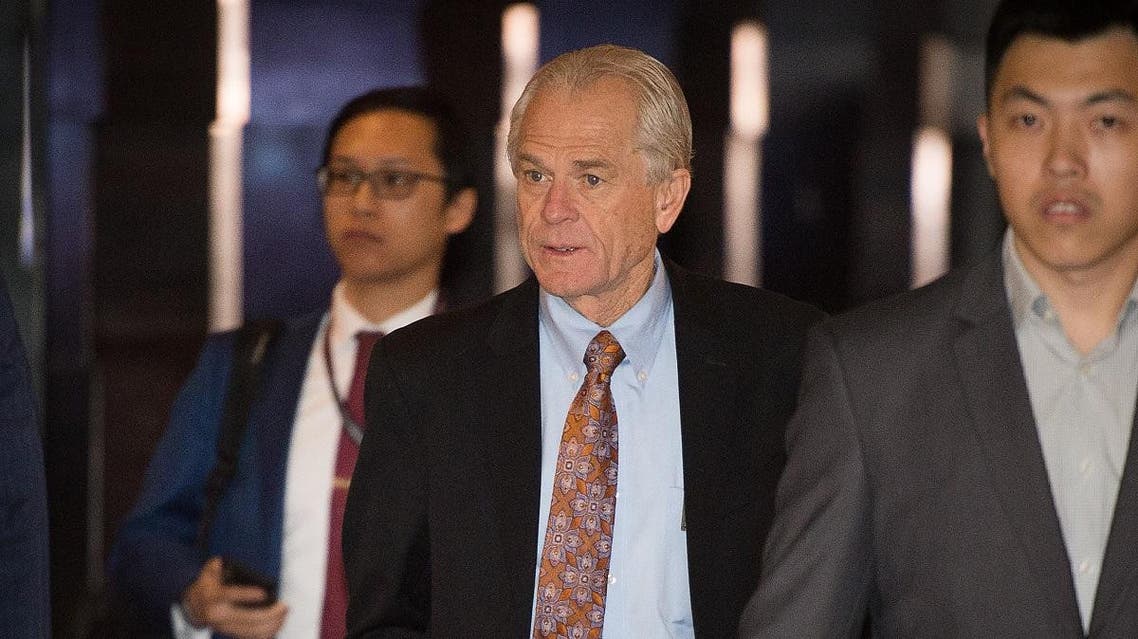 White House economic adviser Peter Navarro (C) walks through a hotel lobby as he heads to the Diaoyutai State Guest House to meet Chinese officials. (AFP)