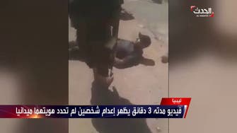 Libyan National Army brutally executes two men on a public street