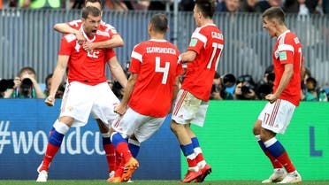 Russia's Artem Dzyuba celebrates scoring their third goal with team mates. (Reuters)