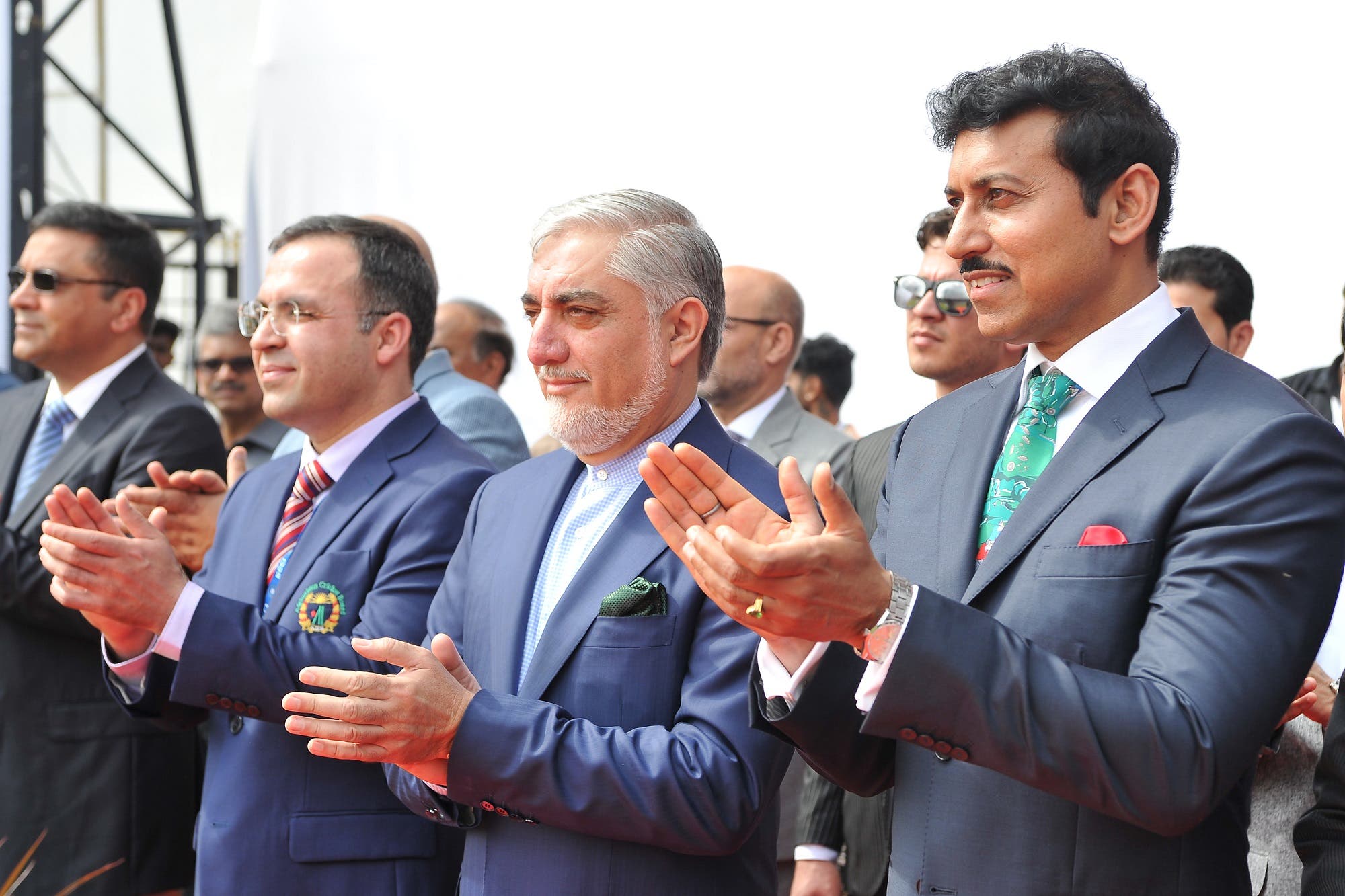 India’s minister for sports Rajyavardhan Singh Rathore (R) and Afganistan’s Chief Executive Abdullah Abdullah (2nd R) applaud prior to the start of the one-off Test match between India and Afghanistan in Bangalore on June 14, 2018. (AFP)