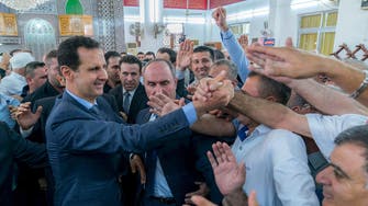 Syria's Assad in rare appearance outside capital