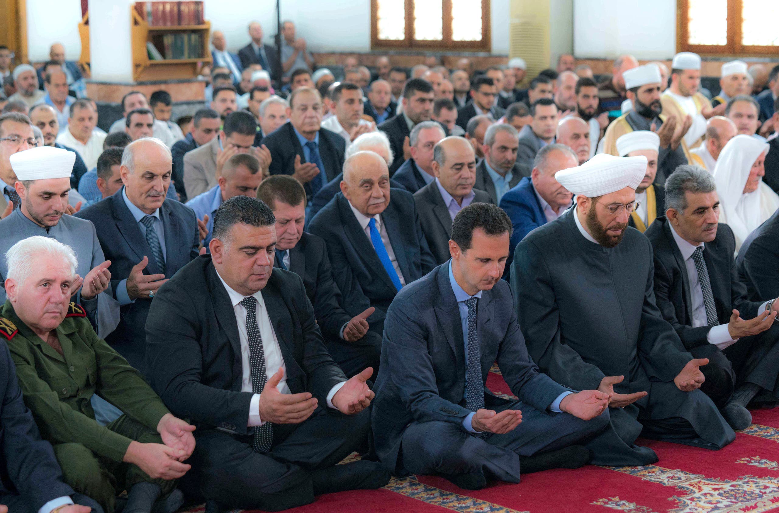 bashar assad rare appearance eid prayers. (AP)
