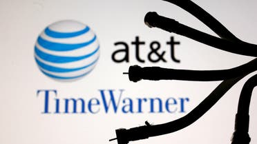 Coaxial TV Cables seen in front of AT&T and Time Warner logos in this picture illustration taken on June 13, 2018. (Reuters)