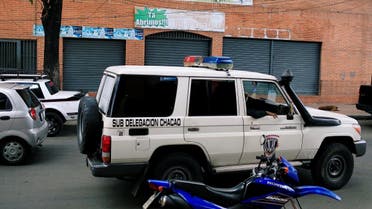 Officers of the Body of Scientific, Penal and Criminal Investigation drive past the Los Cotorros club where several people died when a person activated a tear gas grenade inside according to Venezuela's interior minister Reverol. (Reuters)