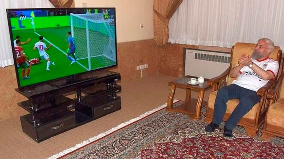 Rouhani tweeted a picture of himself clapping, wearing trousers and the national team’s football shirt.