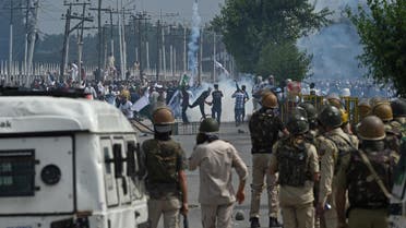 Kashmiri youths throw stones during clashes between protesters and Indian government forces in Srinagar on June 16, 2018. (AFP)