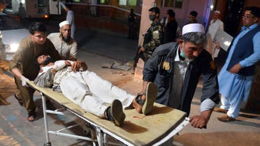 A wounded man is brought by stretcher into a hospital in Jalalabad city, capital of Nangarhar province, east of Kabul, Afghanistan, Saturday, June 16, 2018. (AP)