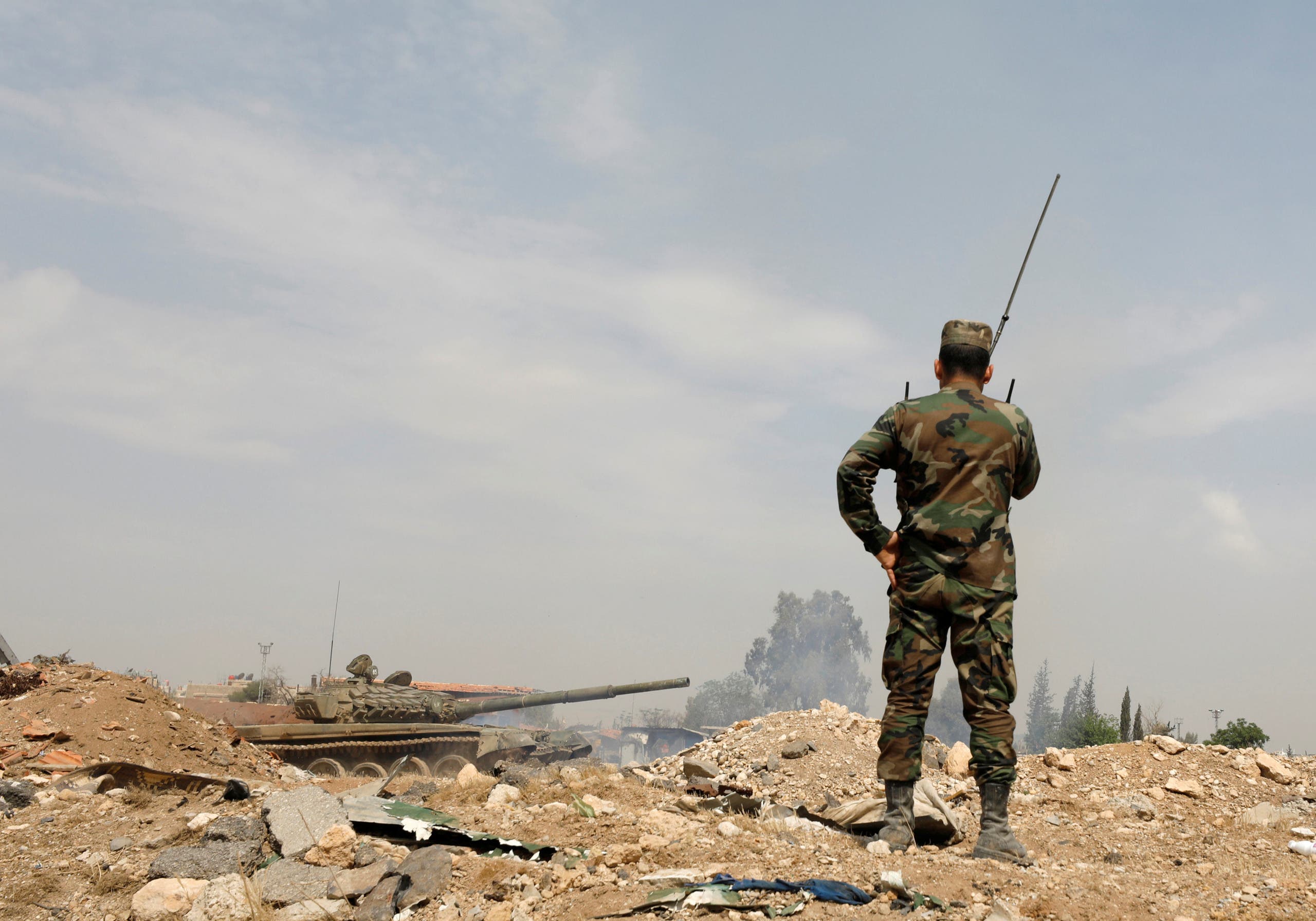 Soldiers loyal to Syria's President Bashar al-Assad forces are deployed at al-Qadam area near Yarmouk Palestinian camp in Damascus,Syria April 29,2018.REUTERS/