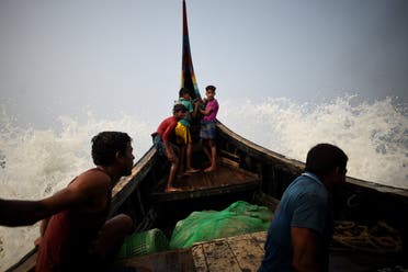 Waves hit a fishing boat crewed by Rohingya refugees in the Bay of Bengal near Cox's Bazaar, Bangladesh. (Reuters)
