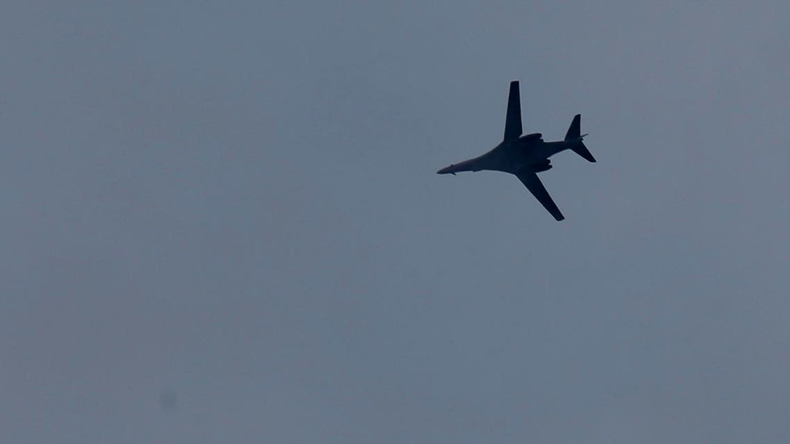 A fighter aircraft of the US-led coalition flies over Mursitpinar in the outskirts of Suruc, at the Turkey-Syria border, as it approaches Syria to deliver an airstrike in Kobani, during fighting between Syrian Kurds and the militants of Islamic State group. (AP)