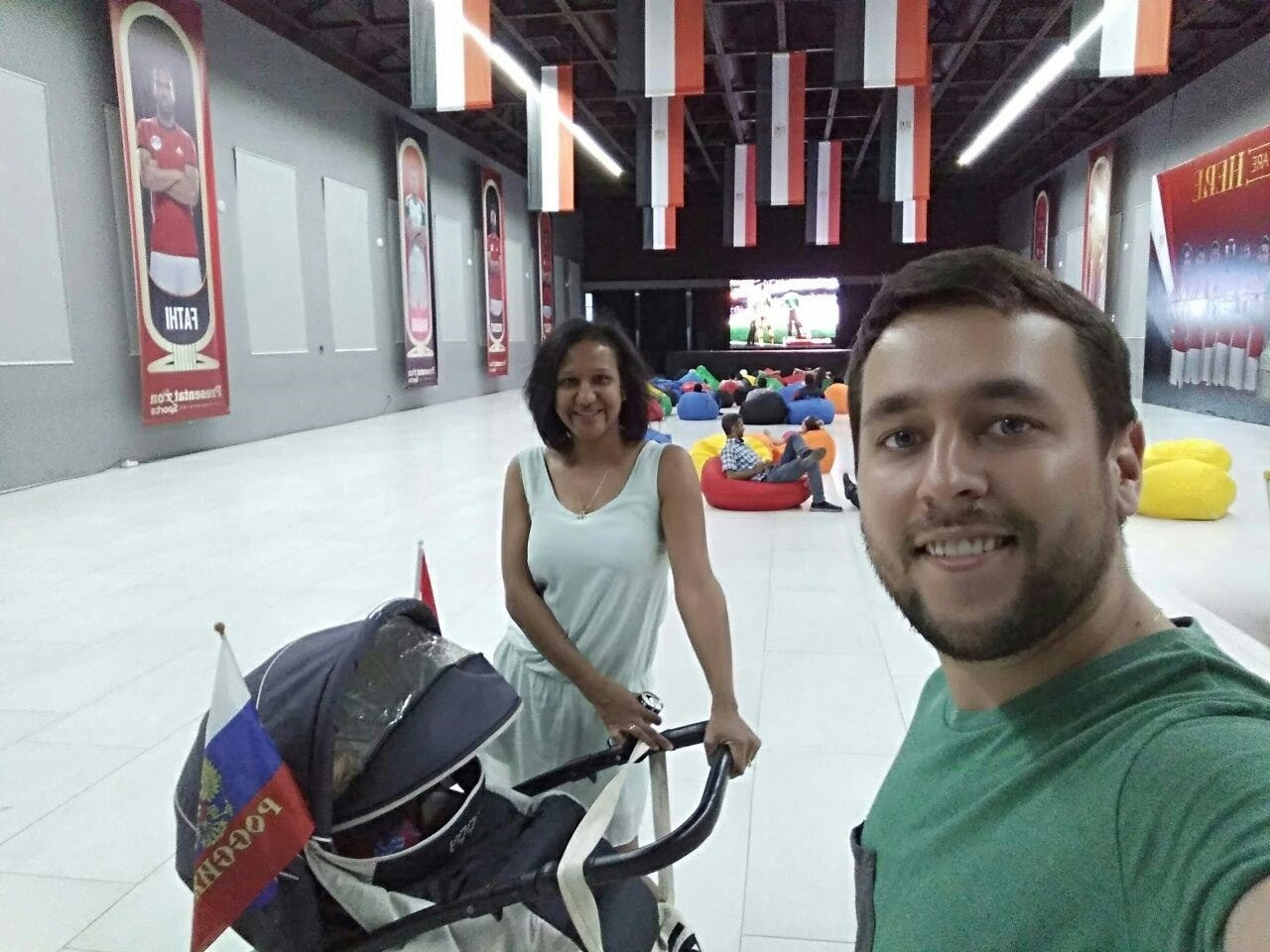 Lamiaa and Sergei go with their child Alexander to the zone where Egyptian fans sit every day to watch the football games. (Supplied)