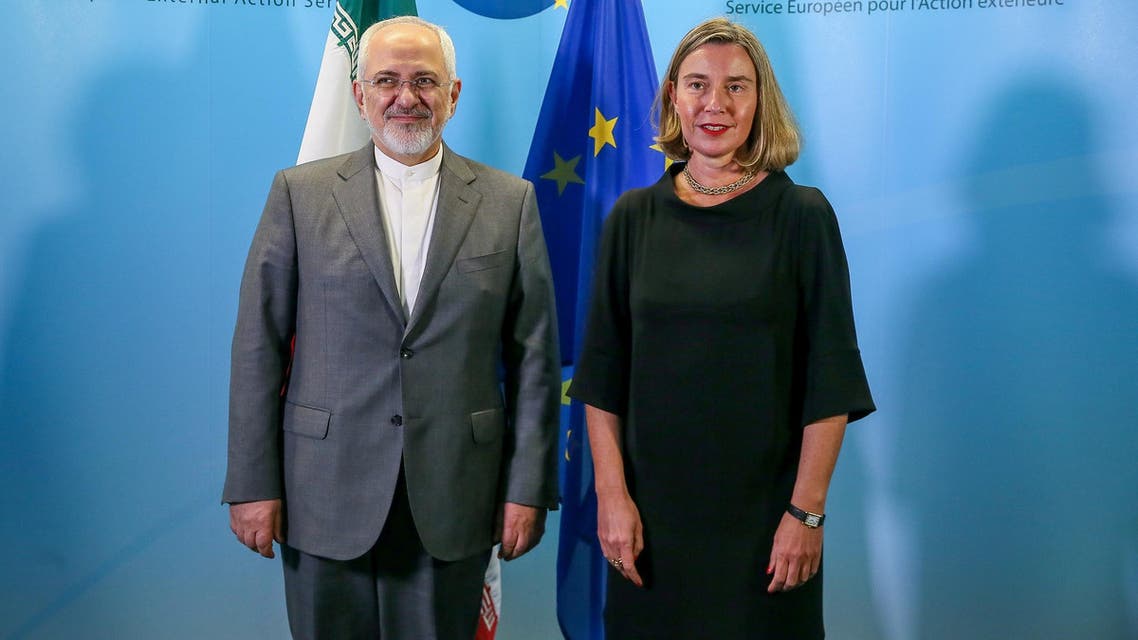 Iran’s Foreign Minister Mohammad Javad Zarif (L) with European Union Foreign Policy Chief Federica Mogherini in Brussels on April 25, 2018. (AFP)