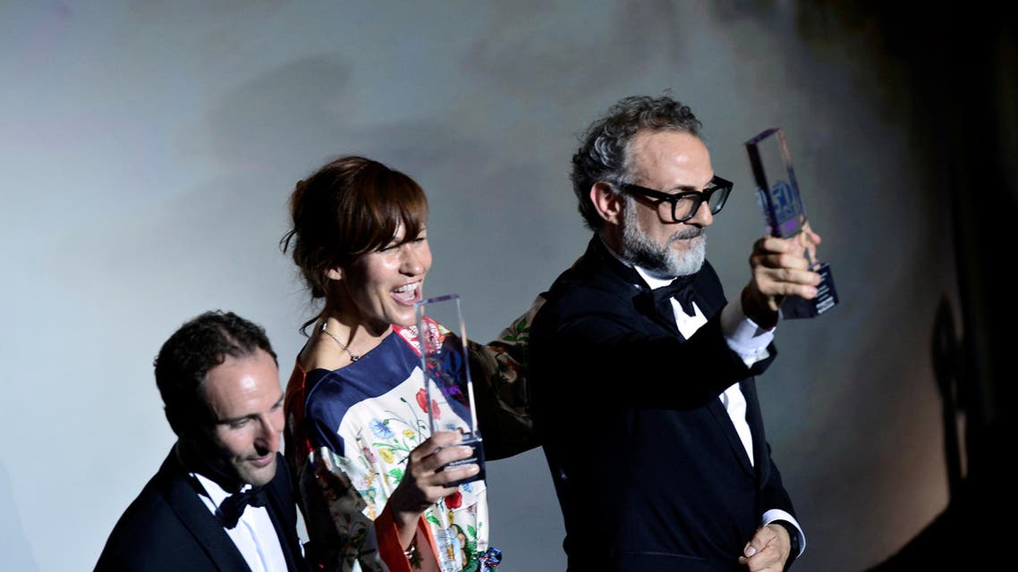 Massimo Bottura, the chef patron of Osteria Francescana restaurant in Italy, next to his wife Lara Gilmore, receives the award for Best Restaurant during the World's 50 Best Restaurants Awards at the Palacio Euskalduna in Bilbao, Spain, June 19, 2018. REUTERS