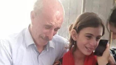 Yazidi father and daughter. (Twitter)
