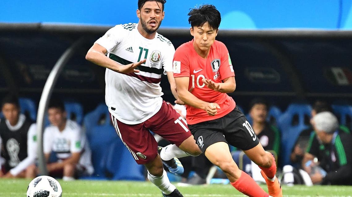 Mexico’s forward Carlos Vela (L) vies with South Korea's midfielder Lee Seung-woo during the Russia 2018 World Cup Group F football match on June 23, 2018. (AFP)