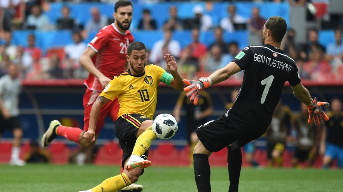 Belgium’s forward Eden Hazard (L) knocks the ball over Tunisia’s goalkeeper Farouk Ben Mustapha (R) during the Russia 2018 World Cup Group G football match on June 23, 2018. (AFP)