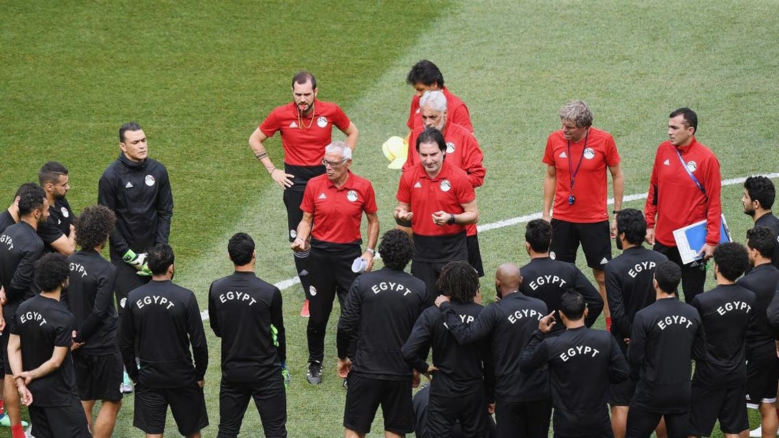Egypt's Argentine coach Hector Cuper (C-L) speaks to his team at the Volgograd Arena in Volgograd on June 24, 2018, on the eve of their Group A match against Saudi Arabia during the Russia 2018 World Cup football tournament. Mark RALSTON / AFP