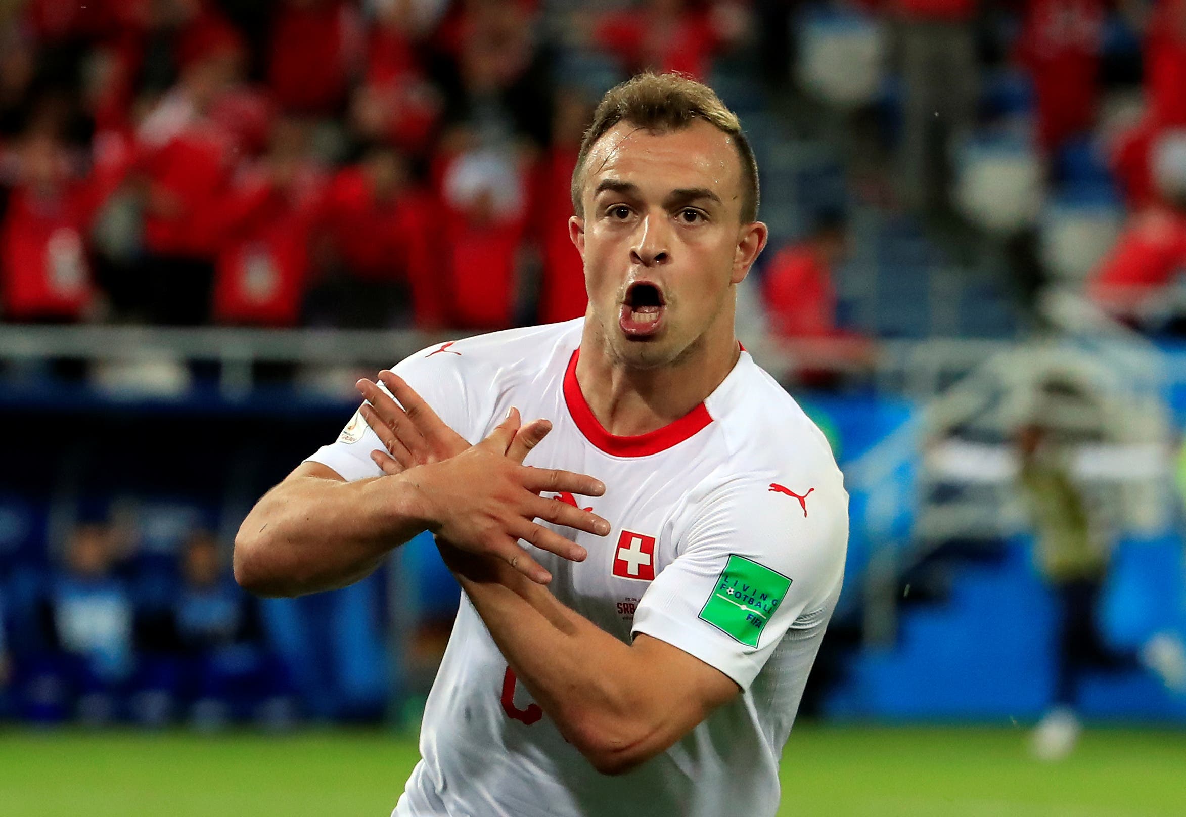 Xherdan Shaqiri celebrates his goal agaisnt South Korea which gave Switzerland the lead. (Reuters)