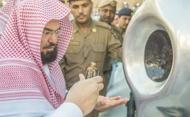 Who are the 24 men that guard the sacred Black Stone in Mecca?