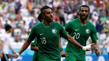 Saudi Arabia's Salem Al-Dawsari celebrates with Muhannad Assiri after scoring their second goal. (Reuters)