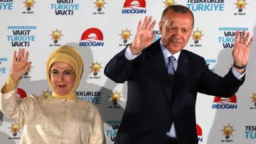 Turkish President Tayyip Erdogan and his wife Emine Erdogan greet supporters at the AKP headquarters in Ankara, Turkey June 25, 2018. (AFP)