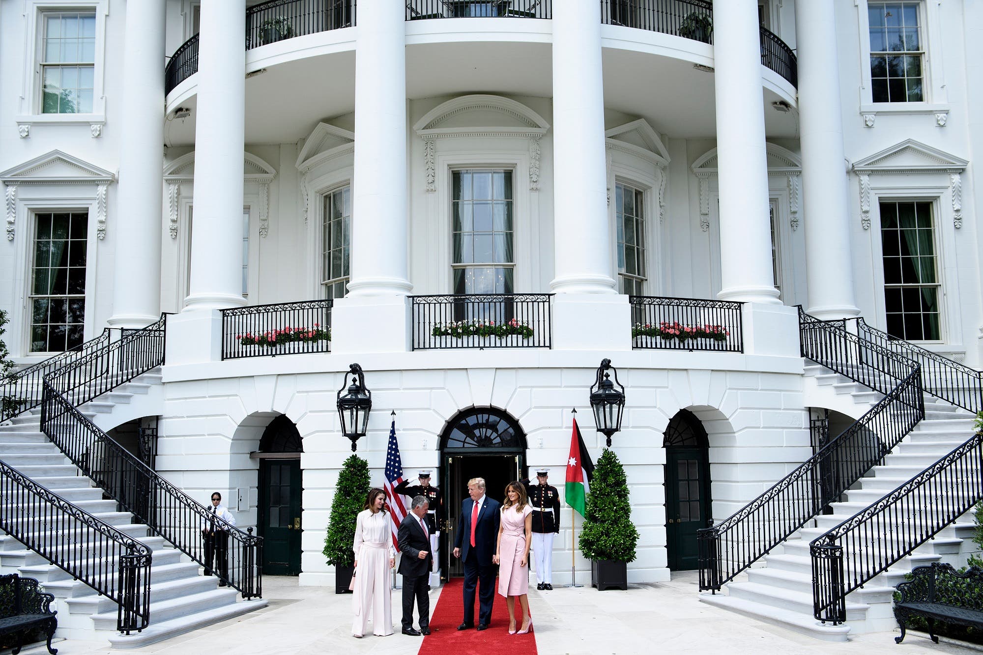 President Trump (2R) and First Lady Melania Trump greet Jordan’s King Abdullah II and Queen Rania in Washington, DC on June 25, 2018. (AFP)