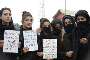 Kashmiri law students hold placards during a protest following the rape and murder of an eight-year-old girl in the Indian state of Jammu and Kashmir, in Srinagar, on April 18, 2018. (AFP)