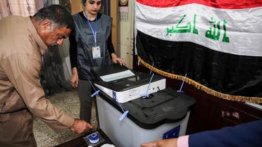 An Iraqi voter dips his finger in ink before casting his ballot at a poll station in the capital Baghdad’s Karrada district on May 12, 2018. (AFP)