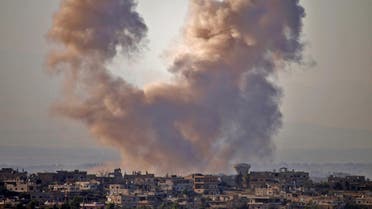 Smoke rises above opposition held areas of the Daraa province countryside during airstrikes by Syrian regime forces on June 27, 2018. (AFP)