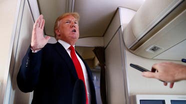 Trump speaks to the press aboard Air Force One en route to Bedminster, New Jersey, from Joint Base Andrews. (Reuters)