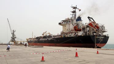 A man walks past a ship at the Red Sea port of Hodeidah, Yemen. (Reuters)
