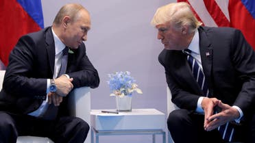 FILE PHOTO: Russia's President Vladimir Putin talks to U.S. President Donald Trump during their bilateral meeting at the G20 summit in Hamburg, Germany, July 7, 2017. REUTERS/Carlos Barria//File Photo