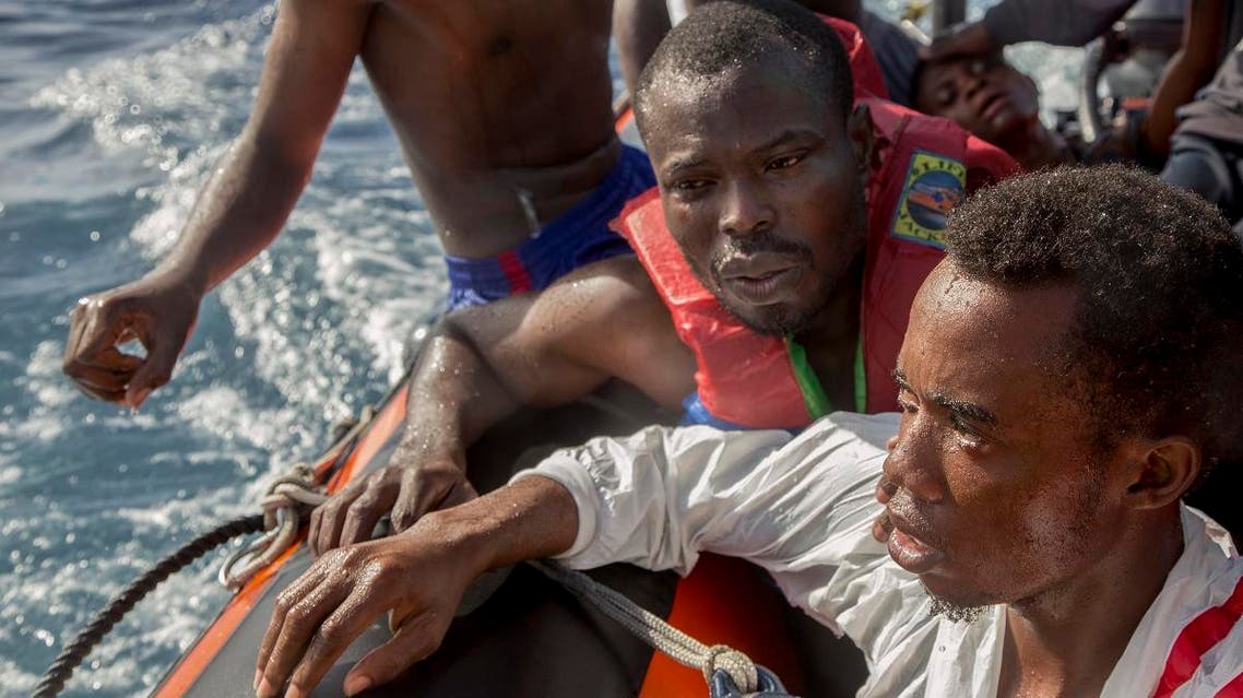 Migrants are rescued by members of German NGO Sea-Watch in the Mediterranean Sea on November 6, 2017. During a shipwreck, five people died, including a newborn child. According to the German NGO Sea-Watch, which has saved 58 migrants, the violent behavior of the Libyan coast guard caused the death of five persons.