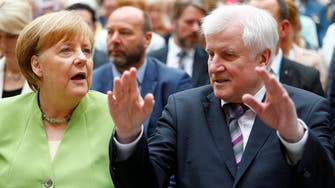 Germany’s interior minister resigns in migration showdown with Merkel