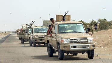 Yemeni fighters from the Amalqa (Giants) Brigades gather with armed pick-up trucks and armored vehicles on the side of a road during the offensive to seize the Red Sea port city of Hodeidah. (AFP)