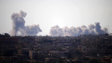 Smoke rises above rebel-held areas of the city of Daraa during airstrikes by Syrian regime forces on June 30, 2018. (AFP)