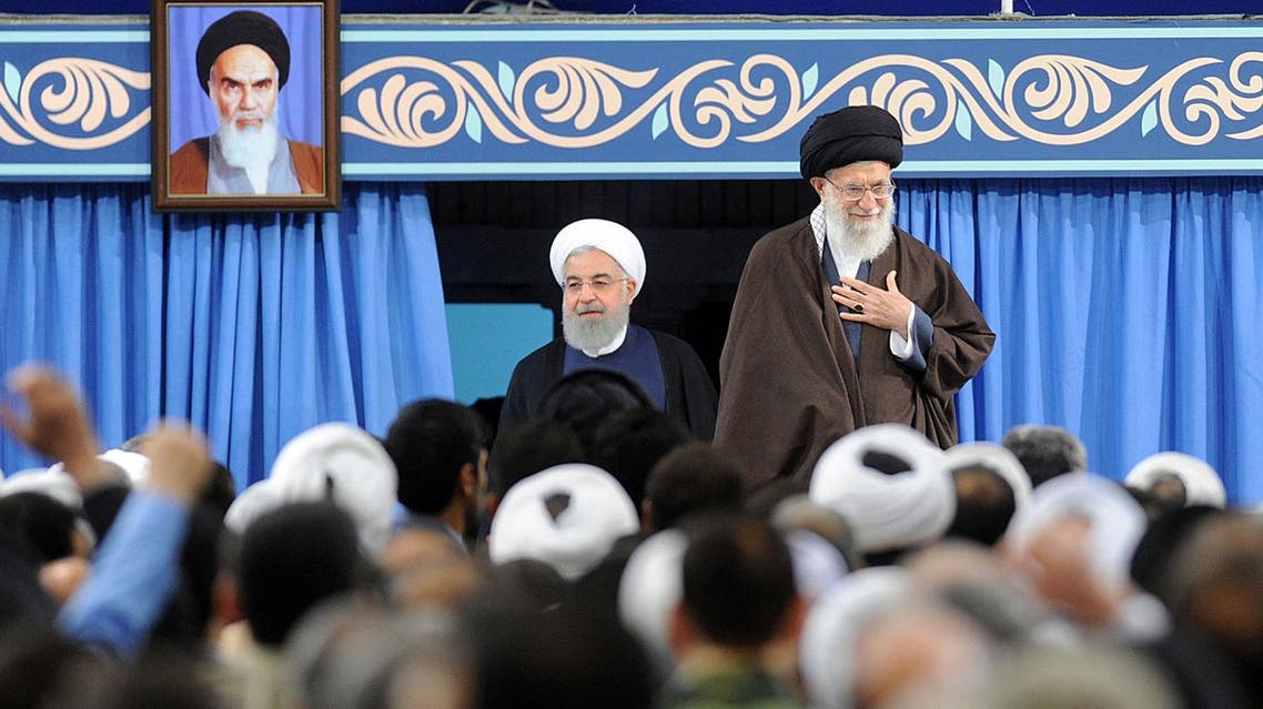 Iran’s Supreme Leader Ayatollah Ali Khamenei and President Hasan Rouhani (L) arriving for a ceremony in Tehran on April 14, 2018. (AFP)
