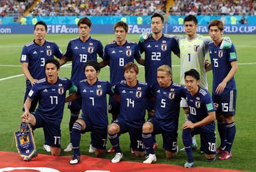 Japan players pose for a team group photo before the match. (Reuters)