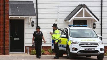 Police officers outside a residential address in Amesbury, southern England, on July 4, 2018 where police reported a man and woman were found unconscious. (AFP)
