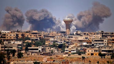 Smoke rises above rebel-held areas of the city of Daraa during reported airstrikes by Syrian regime forces on July 5, 2018. Waves of air strikes pounded rebel-held areas of southern Syria after the failure a day earlier of Russian-brokered talks to end the offensive in Daraa province, which has killed dozens and forced tens of thousands from their homes.
