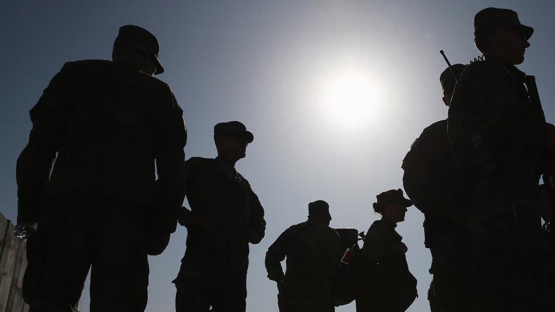 FOB GAMBERI, AFGHANISTAN - DECEMBER 07: Members of the US military stand by after listening to U.S. Secretary of Defense Chuck Hagel speak to American troops, December 7, 2014 in FOB Gamberi, Afghanistan. Secretary Hagel visited the Forward Operating Base to meet with Afghanistan military officials and visit with American troops stationed there. Mark Wilson/Getty Images/AFP