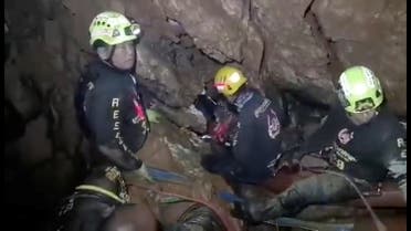 Ruamkatanyu Foundation rescuers are seen trying to find alternative entrance to the Tham Luang cave complex, where 12 boys and their soccer coach are trapped, in the northern province of Chiang Rai, Thailand. (FB screen grab/Reuters)