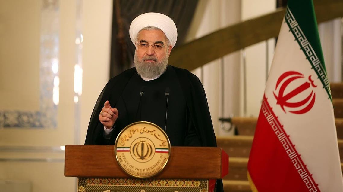 A handout picture provided by the office of Iranian President Hassan Rouhani on October 13, 2017 shows him speaking on Iranian state TV Broadcast in reaction to a speech by US President. US President Donald Trump's speech in which he outlined an aggressive new strategy against Iran shows that he is "more than ever against the Iranian people", President Hassan Rouhani said.