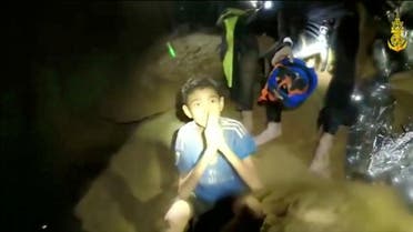 Boys from the under-16 soccer team trapped inside Tham Luang cave greet members of the Thai rescue team in Chiang Rai. (Reuters)