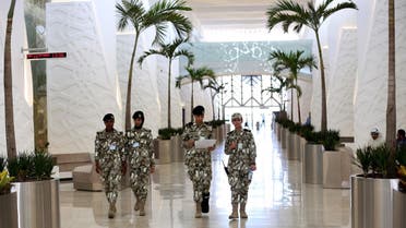 Kuwaiti National Assembly guards walk inside the building in Kuwait City on October 16, 2016. (AFP)
