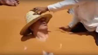 WATCH: Video of Moroccan minister being buried in hot sand goes viral