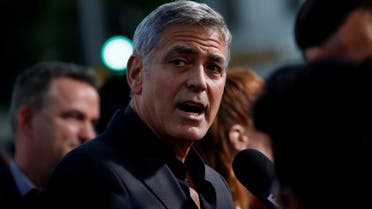 FILE PHOTO: Director George Clooney is interviewed at the premiere for Suburbicon in Los Angeles, California, U.S., October 22, 2017. REUTERS/Mario Anzuoni/File Photo