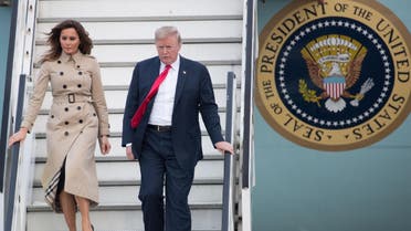US President Donald Trump (R) and US First Lady Melania Trump disembark from Air Force One as they arrive at Melsbroek Air Base in Haachtsesteenweg on July 10, 2018. US President Donald Trump has arrived in Brussels on the eve of a tense NATO summit where he is set to clash with allies over defence spending. Trump arrived on Air Force One. (AFP)