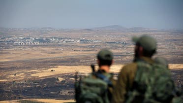 Israel Israeli soldiers look at the Syrian side of the Israel-Syria border on the Israeli-occupied Golan Heights, Israel July 7, 2018. (Reuters)